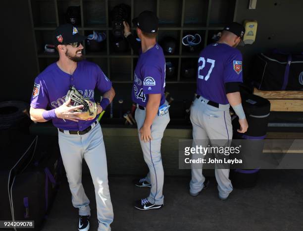 Colorado Rockies outfielder David Dahl third baseman Ryan McMahon and shortstop Trevor Story get ready for the game agains the Texas Rangers on...