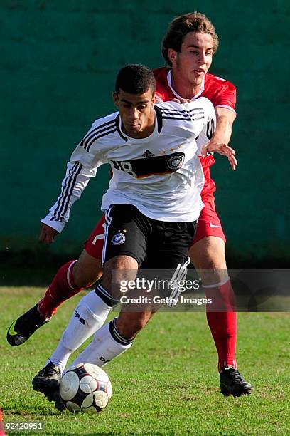 Murat Bildrici of Germany and Hasan Turk of Turkey fight for the ball during the U17 Euro qualifying match between Germany and Turkey on October 28,...