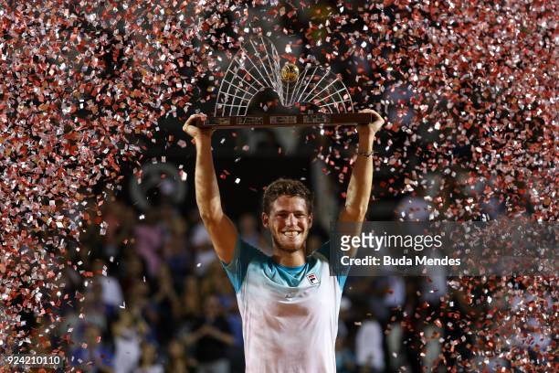 Diego Schwartzman of Argentina celebrates with the trophy after defeating Fernando Verdasco of Spain at the singles final of the ATP Rio Open 2018 at...