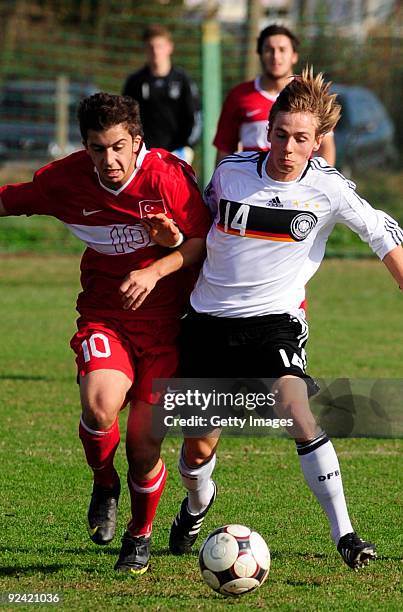 Jannis Plaschke of Germany and Taskin Calas of Turkey fight for the ball during the U17 Euro qualifying match between Germany and Turkey on October...