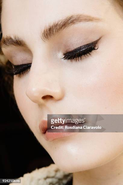 Model, make up detail, is seen backstage ahead of the Les Copains show during Milan Fashion Week Fall/Winter 2018/19 on February 22, 2018 in Milan,...