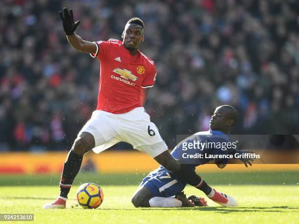 Paul Pogba of Manchester United is tackled by N'Golo Kante of Chelsea during the Premier League match between Manchester United and Chelsea at Old...