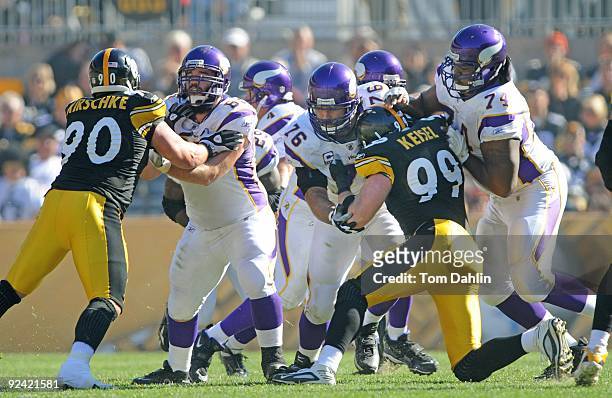 Offensive linemen John Sullivan, Steve Hutchinson, and Bryant McKinnie of the Minnesota Vikings at work during an NFL game against the Pittsburgh...
