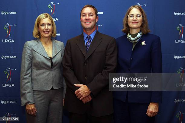 Dawn Hudson, Michael Whan and Leslie Greis pose for a photo during a press conference to announce Whan as the new LPGA Commissioner on October 28,...