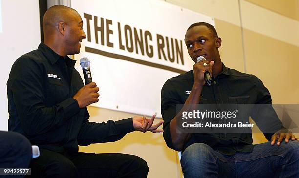 The Long Run' charity embassadors and sprinters Usain Bolt of Jamaica and Colin Jackson of Great Britain chat during a news conference of the Zeitz...