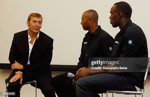 The Long Run' charity embassadors and sprinter Usain Bolt of Jamaica and former sprinter Colin Jackson from Great Britain listen to Jochen Zeitz,...