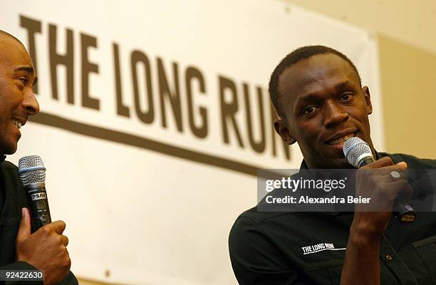 The Long Run' charity embassadors and sprinters Usain Bolt of Jamaica and Colin Jackson of Great Britain joke during a news conference of the Zeitz...