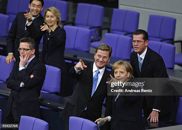 Chairman of the German Free Democrats and new German Vice Chancellor and Foreign Minister Guido Westerwelle and German Chancellor Angela Merkel...