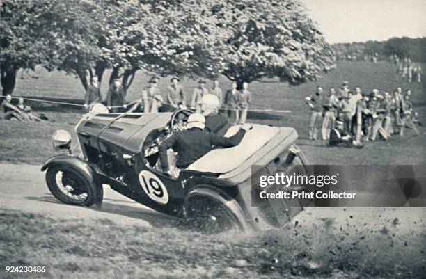 The beginning of a spill at Donington Park', 1937. From Sir Malcolm Campbell's Book of Famous Motorists, edited by Sir Malcolm Campbell. [Blackie &...