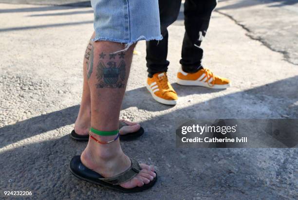 Manchester City fan with a tattoo of the club badge on his leg before the Carabao Cup Final between Arsenal and Manchester City at Wembley Stadium on...