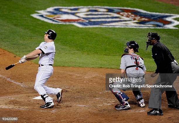 Mark Teixeira of the New York Yankees hits a walk off home run in the eleventh inning against the Minnesota Twins in Game Two of the ALDS during the...