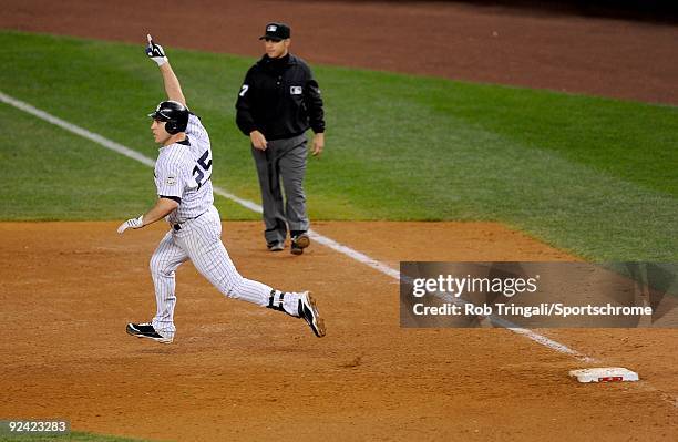 Mark Teixeira of the New York Yankees reacts rounding first base after hitting a walk off home run in the eleventh inning against the Minnesota Twins...