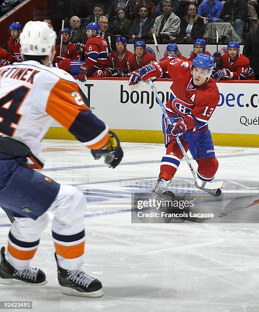 Mike Cammalleri of the Montreal Canadiens waits for a pass in front of Radek Martinek of the New York Islanders during the NHL game on October 22,...