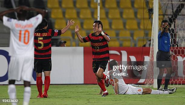 South Korea's Pohang Steelers players celebrate after beating Qatari Umm Salal club in their AFC Champions League second-leg semi-final match in Doha...