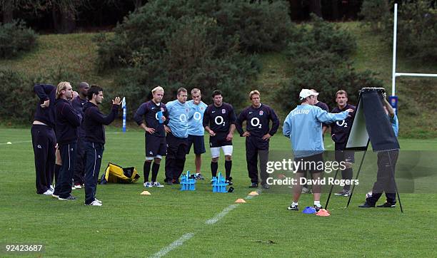 England attack coach Brian Smith issues instructions to the backs during the England training session held at Pennyhill Park on October 28, 2009 in...