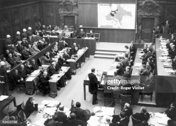 World War II. Nuremberg trials . Prosecutor Jackson's deposition, at the beginning of the lawsuit. In the background: map showing the countries...