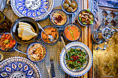 Middle eastern or arabic dishes and assorted meze, concrete rustic background