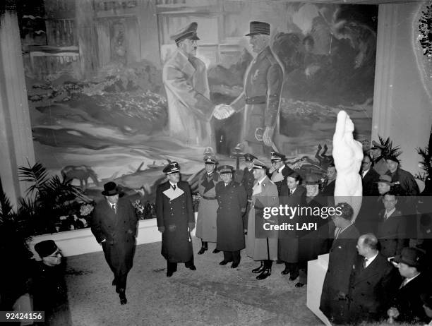 World War II. Schleier, de Brinon, Barckhausen, Marion and Berdt at the opening of the antibolshevic exhibition. Fresco representing Pétain and...