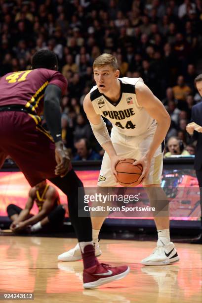 Minnesota Golden Gophers forward Gaston Diedhiou guards Purdue Boilermakers center Isaac Haas during the Big Ten Conference college basketball game...