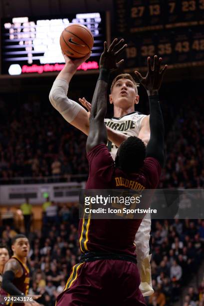 Purdue Boilermakers center Isaac Haas shoots the ball over Minnesota Golden Gophers forward Gaston Diedhiou during the Big Ten Conference college...
