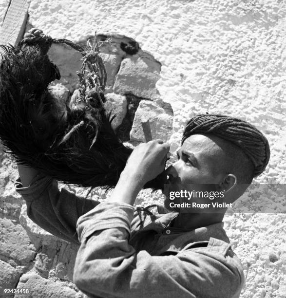 Morocco. Moroccan soldier in the French army, drinking at the flask, 1945.