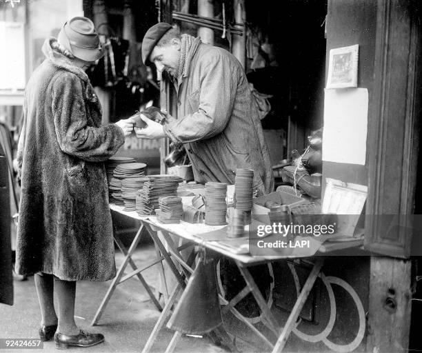 World War II. Pedlar selling insoles during the Occupation of Paris.
