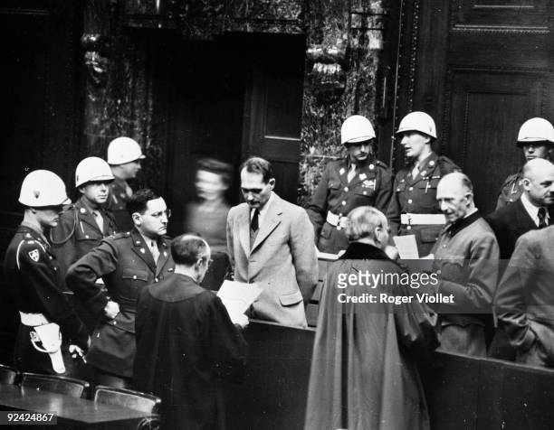 World War II. Nuremberg trials. American Captain Gustav Mark Gilbert, psychologist of the prison for the length of the trial, observing Rudolf Hess,...