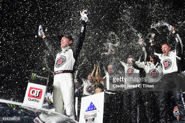 Kevin Harvick, driver of the Jimmy John's Ford, celebrates in Victory Lane after winning the Monster Energy NASCAR Cup Series Folds of Honor QuikTrip...