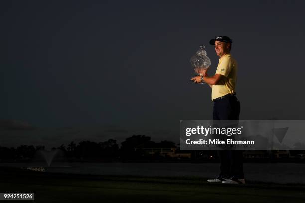 Justin Thomas with the winner's trophy after winning a playoff during the final round of the Honda Classic at PGA National Resort and Spa on February...