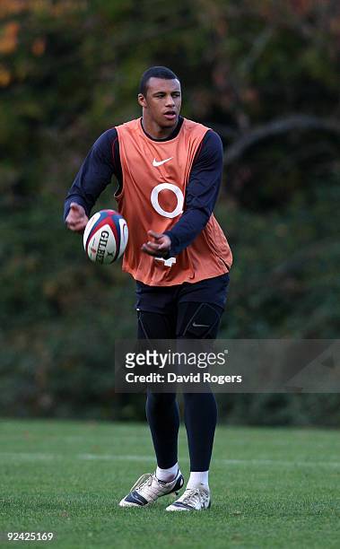 Courtney Lawes passes the ball during the England training session held at Pennyhill Park on October 28, 2009 in Bagshot, England.