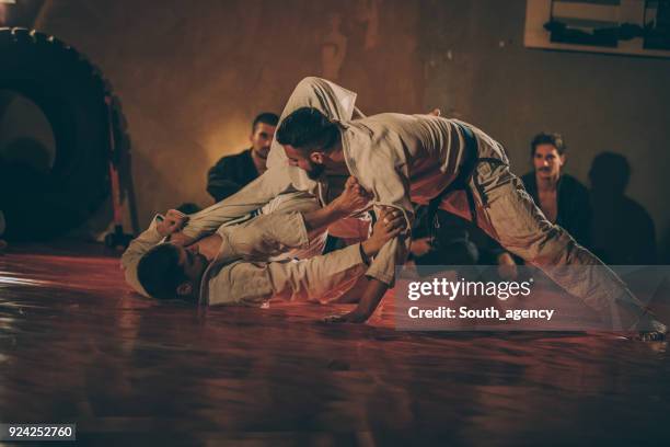 two men practicing martial arts - jujitsu stock pictures, royalty-free photos & images