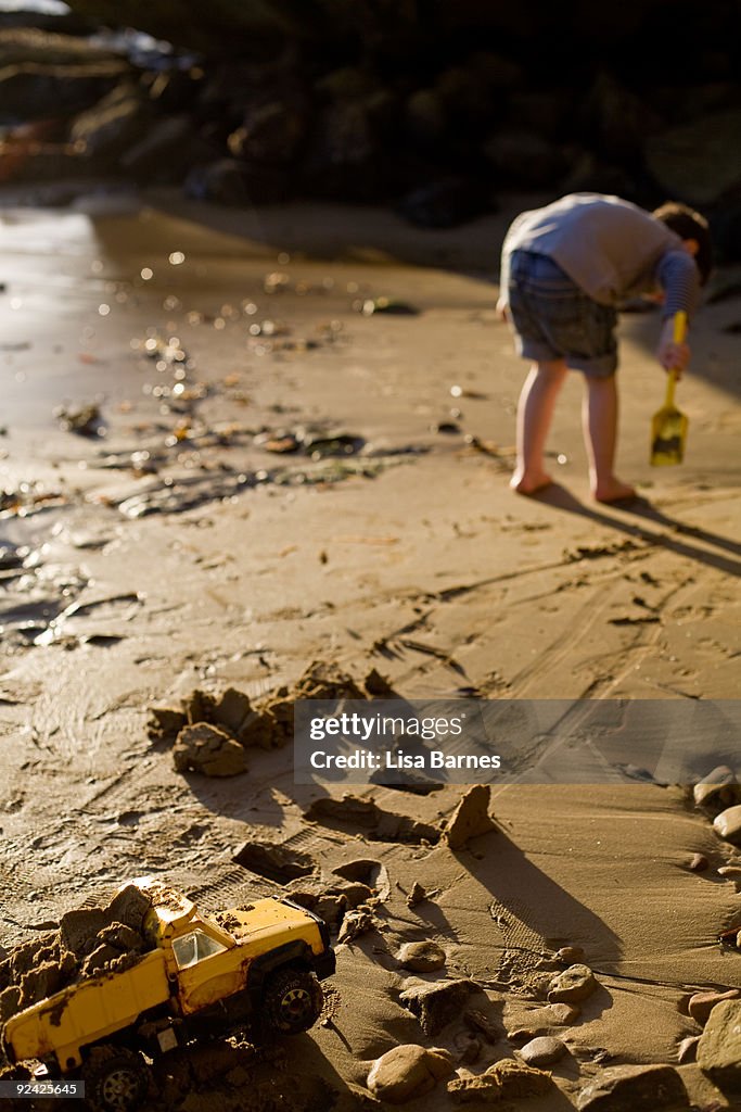 Boy playing on sand