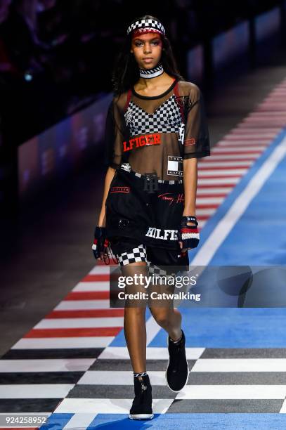 Model walks the runway at the TOMMYNOW by Tommy Hilfiger Spring Summer 2018 fashion show during Milan Fashion Week on February 25, 2018 in Milan,...