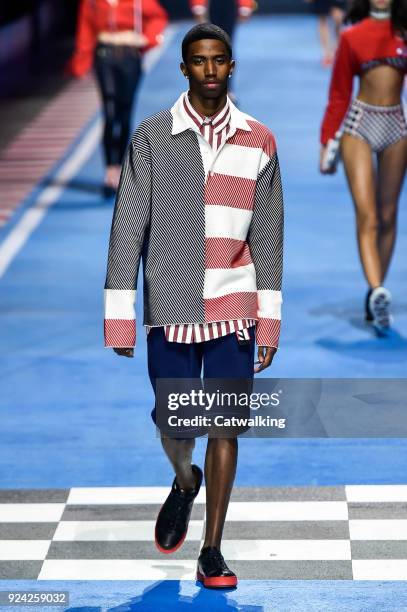 Model walks the runway at the TOMMYNOW by Tommy Hilfiger Spring Summer 2018 fashion show during Milan Fashion Week on February 25, 2018 in Milan,...