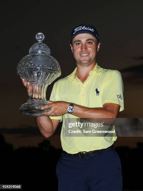 Justin Thomas with the winner's trophy after winning a playoff during the final round of the Honda Classic at PGA National Resort and Spa on February...