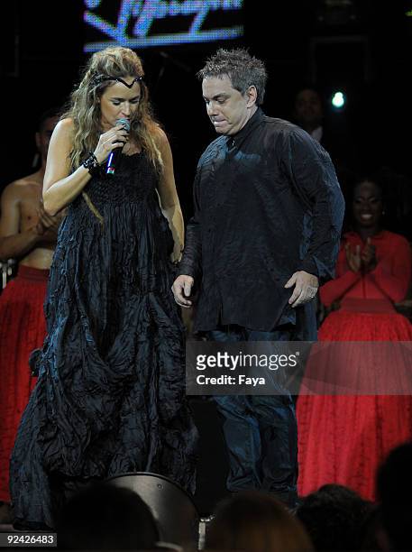 Brazilian pop singer Daniela Mercury and designer Lino Villaventura attends his fashion show on Oi Fashion Rocks at Rio's Jockey Club on October 24,...