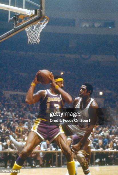Willis Reed of the New York Knicks closely guards Wilt Chamberlain of the Los Angeles Lakers during an NBA basketball game circa 1969 at Madison...