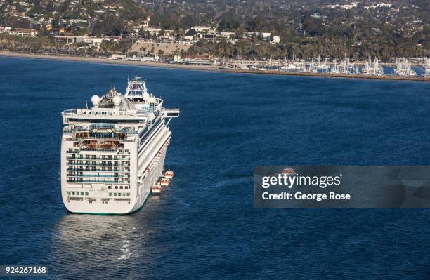 The Ruby Princess, a Grand-class cruise ship operated by Princess Cruises, is viewed in this aerial photo docked in the harbor on February 23 in...