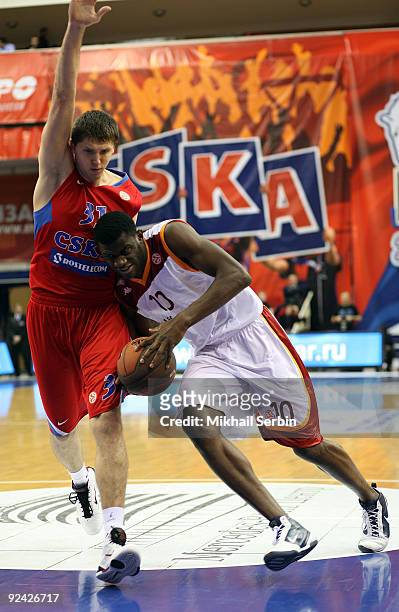 Herve Toure, #10 of Lottomatica Roma competes with Viktor Khryapa, #31 of CSKA Moscow during the Euroleague Basketball Regular Season 2009-2010 Game...