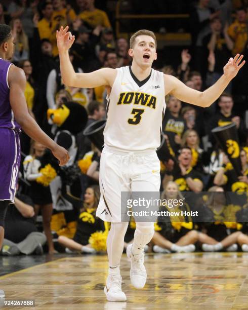 Guard Jordan Bohannon of the Iowa Hawkeyes celebrates a three-point basket during the first half against the Northwestern Wildcats on February 25,...