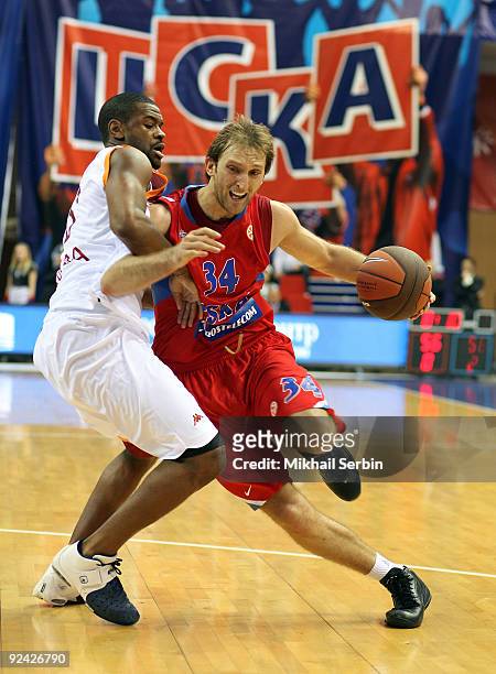 Zoran Planinic, #34 of CSKA Moscow competes with Ricky Minard, #18 of Lottomatica Roma in action during the Euroleague Basketball Regular Season...