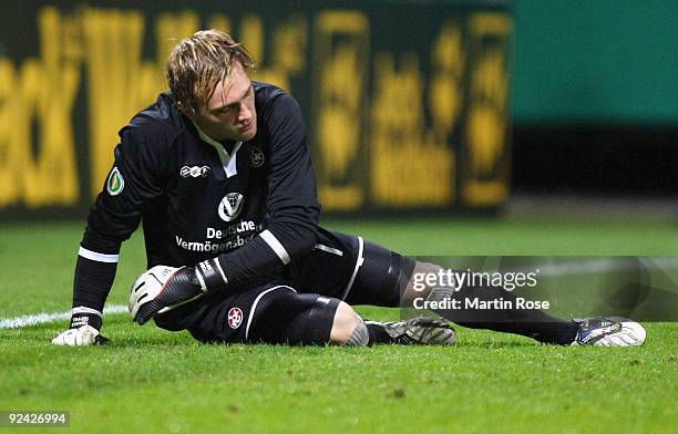 Goalkeeper Tobias Sippel of Kaiserslautern looks dejected during the DFB Cup round of 16 match between between Werder Bremen and 1. FC Kaiserslautern...