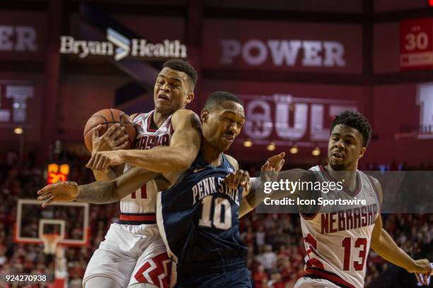 Nebraska guard Evan Taylor and Penn State guard Tony Carr collide into each other going for a rebound during the first half of a college basketball...