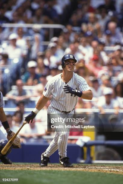 Tino Martinez of the Nwe York Yankees takes a swing during a baseball game against the Cleveland Indians on July 1, 1997 at Yankee Stadium in New...