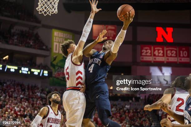 Penn State guard Nazeer Bostick makes a lay up against Nebraska forward Isaiah Roby during the second half of a college basketball game Sunday,...