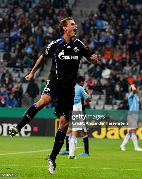 Benedikt Hoewedes of Schalke celebrates after scoring his team's third goal during the DFB Cup round of 16 match between 1860 Muenchen and FC Schalke...