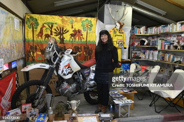 This February 23, 2018 picture shows Reiko Miyoshi a motorcyclist, an essayist and cafe owner, posing for a picture beside her Honda XR400R...