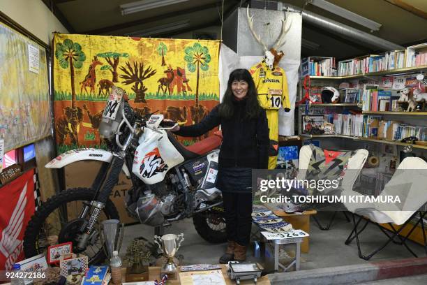 This February 23, 2018 picture shows Reiko Miyoshi a motorcyclist, an essayist and cafe owner, posing for a picture beside her Honda XR400R...