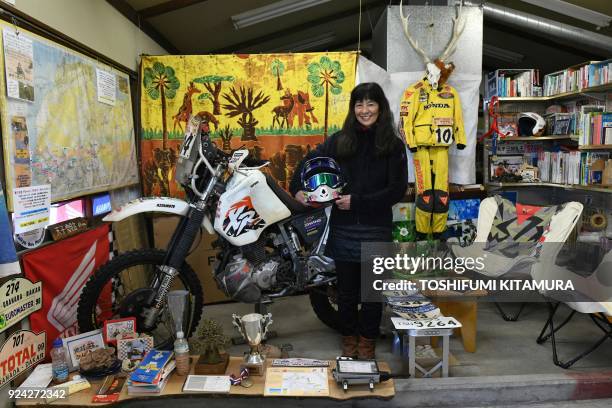 This February 23, 2018 picture shows Reiko Miyoshi a motorcyclist, an essayist and cafe owner, posing for a picture beside her Honda XR400R...