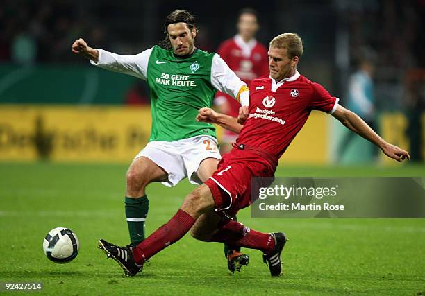 Torsten Frings of Bremen and Adam Nemec of Kaiserslautern compete for the ball during the DFB Cup round of 16 match between between Werder Bremen and...